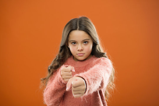 Girl Child Cute But Strong. Self Defense For Kids. Defend Innocence. How Teach Kids To Defend Themselves. Self Defense Strategies Kids Can Use Against Bullies. Girl Hold Fists Ready Attack Or Defend