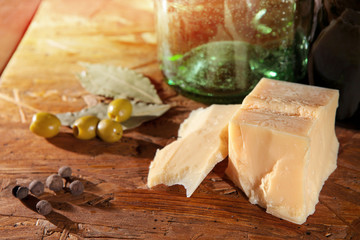 parmesan and olives on wooden surface