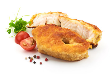Delicious Battered Fish Fillet with herbs, pepper and tomatoes, isolated on a white background. Close-up