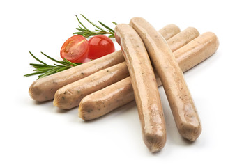 Munich White Fresh Sausges with herbs, pepper and tomatoes, isolated on a white background. Close-up.