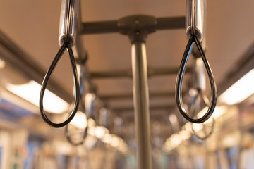 Metropolis handrails in the electric train. Handle sky train, Handles for standing passenger in electric train.