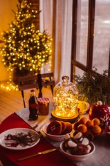 christmas dinner table with candles and decorations