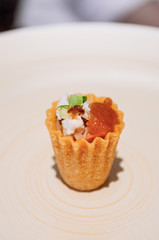Fried crispy shrimp Kueh Pie Tee Singaporean Peranakan cuisine on white plate