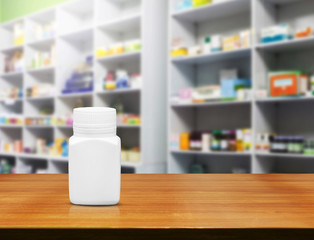 Blank white medicine bottle on counter