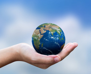 Hands is holding small earth