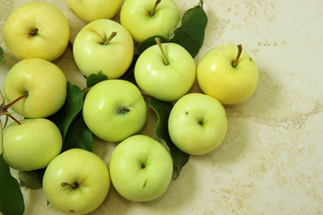Fresh apples on light marble background