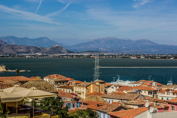 Fototapeta na wymiar Mediterranean landscape district south small city view on waterfront of sea bay and with mountains horizon background scenery in colorful summer day time