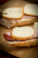 Sandwich with ham and smoked cheese.