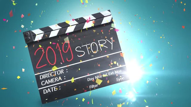 2019 Story,colourful text title on movie Clapper board,confetti celebration 