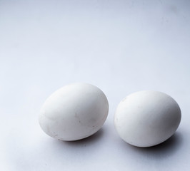 Two eggs or ovums isolated on white of hen.