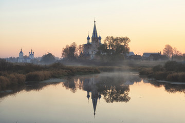 Fototapeta na wymiar Annunciation Monastery in fog sunrise. Dunilovo village. Ivanovo region, Russia