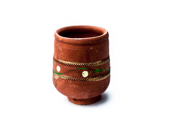 Close up of empty clay glass isolated on white used to serve holy and local drink in it as...