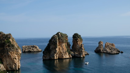 Scopello, Province of Trapani, Sicily. This is small bay containing an old tonnara (tuna fish processing plant). In front of it rises the faraglioni (sea stacks).