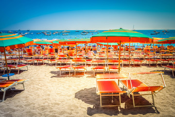 umrellas and chairs on the beach of Positano - famous old italian resort, Italy, retro toned