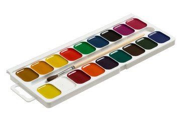 Watercolor paints with a brush isolated on white