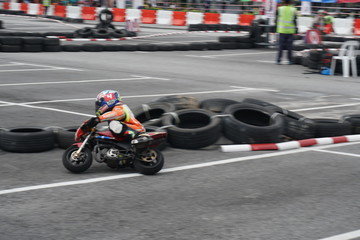 Mini-bike racing through the corner