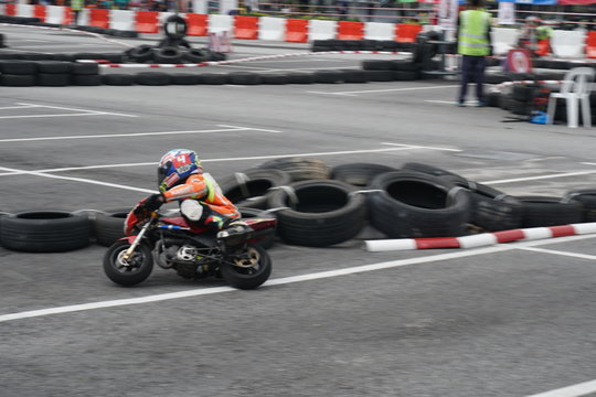 Mini-bike racing through the corner