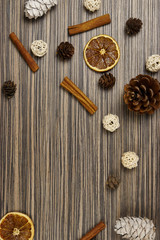 Christmas composition with spices and branches on wood