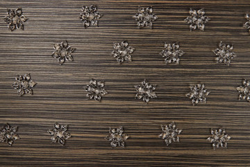acrylic transparent crystal snowflakes on wooden background