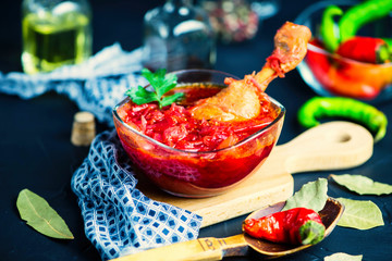 red beet soup with meat in a glass plate on a wooden board