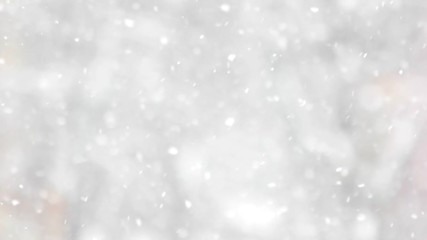 Close up of falling snowflakes. Abstract winter background. Winter holiday wallpaper.