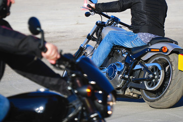 Fototapeta na wymiar Biker in jeans riding a motorcycle