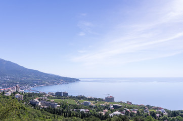 Fototapeta na wymiar Resort city by the sea. Russia, Republic of Crimea, Yalta. 06.13.2018: View of Yalta and the Black Sea from Mount Ai-Petri