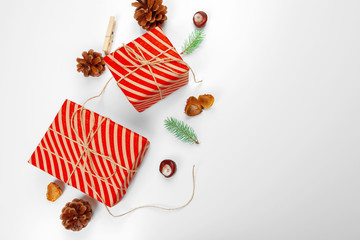 Christmas gift boxes decorated with cone on white background