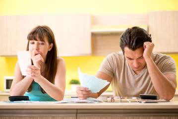 Fototapeta premium Young family struggling with personal finance