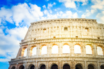 Obraz premium ruins of Colosseum, close up details of facade with cloudy sky, Rome Italy, retro toned