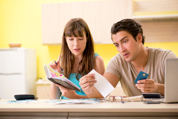 Fototapeta premium Young family struggling with personal finance