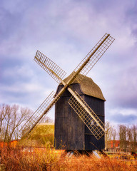 Fototapeta na wymiar Beautiful old historic post windmill.