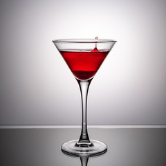 glass of wine on the glass table