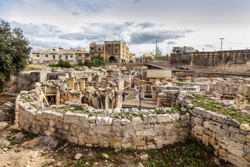 Fototapeta na wymiar HAGAR QIM, MALTA - NOV 11, 2012: Hagar Qim, ancient Megalithic Temple of Malta, is a unesco world heritage site on the island nation of Malta.