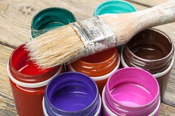 paint bottels on rustic wooden background
