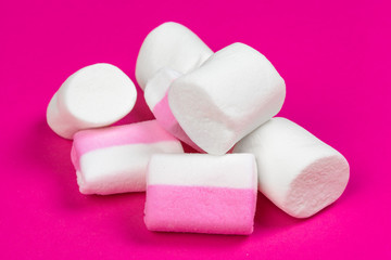 marshmallows on a pink background. top view