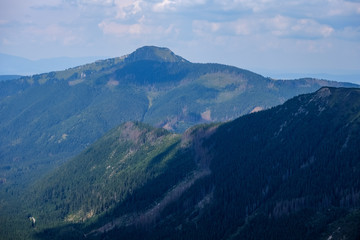 mountain top panorama in  autumn covered in mist or clouds