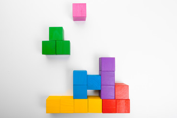 Colorful wooden building blocks isolated on white background