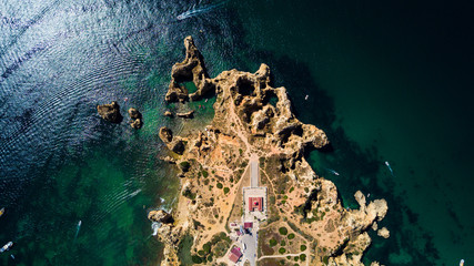 Aerial view of Ponta da Piedade of Lagos, Portugal. Beauty landscape of rugged seaside cliffs and...
