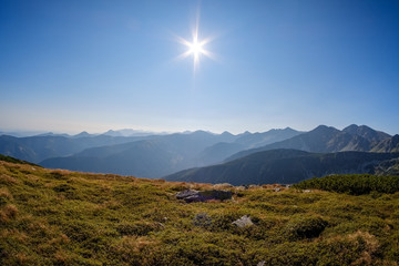 mountain top panorama in  autumn covered in mist or clouds