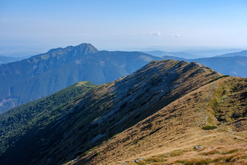 mountain top panorama in  autumn covered in mist or clouds