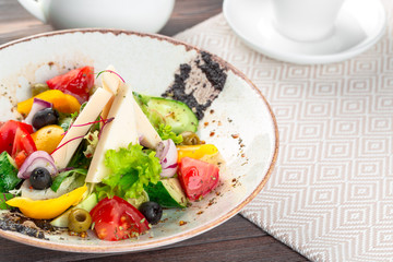 Greek salad with fresh vegetables, feta cheese close up