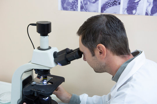 scientist working at the laboratory. Screen image of molecule made by myself