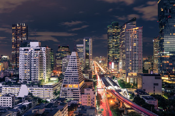 Naklejka premium Bangkok business district cityscape with skyscraper at night, Thailand
