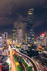 Fototapeta premium Bangkok business district cityscape with skyscraper at night, Thailand
