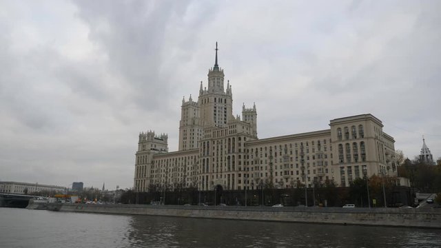 Stalin Vysotka on Kotelnicheskaya embankment view from Moscow river. Late autumn in the capital's quays. Navigable walking river.