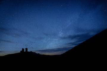 Fototapeta na wymiar Vibrant Milky Way composite image over landscape of Landscape image of enchanting fairytale castle ruins