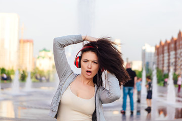 Fototapeta premium Girl listening to music streaming with headphones.