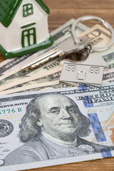 Model house and dollar money banknote concept for mortgage
