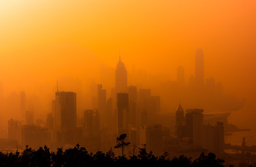 Silhouette of skyline of Hong Kong city with misty.